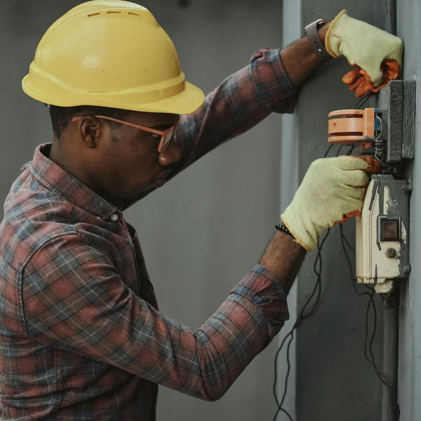 Utility engineer installing meter